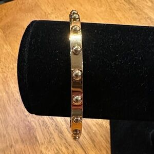 Kate Spade Goldtone Studded Bangle Bracelet with High Polish Finish.